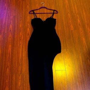 Black spandex and mesh. High thigh slit up side